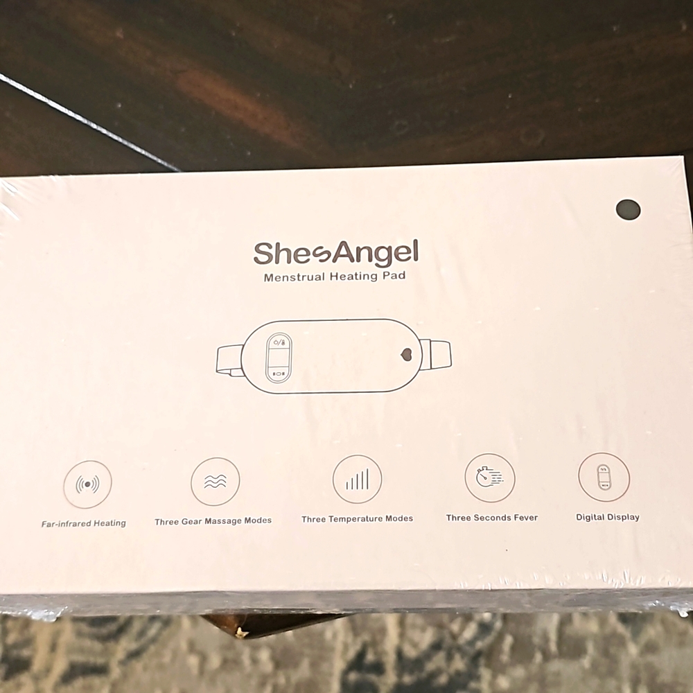 Brand new. Heating and massaging pad